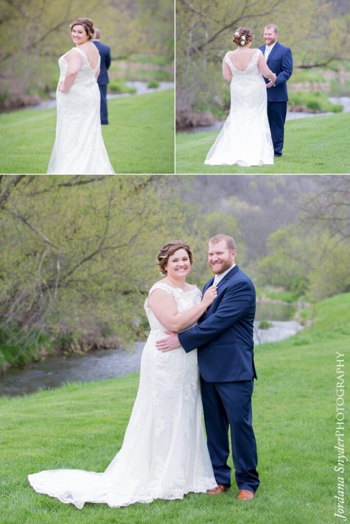 A couple poses for pictures in their wedding attire.