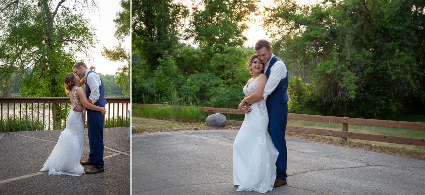 A couple poses for pictures in front of the lake.