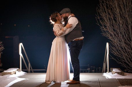 A man and woman are dancing on stage.