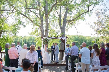 A couple getting married under the trees