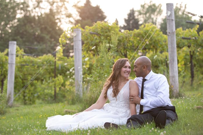 A man and woman sitting in the grass