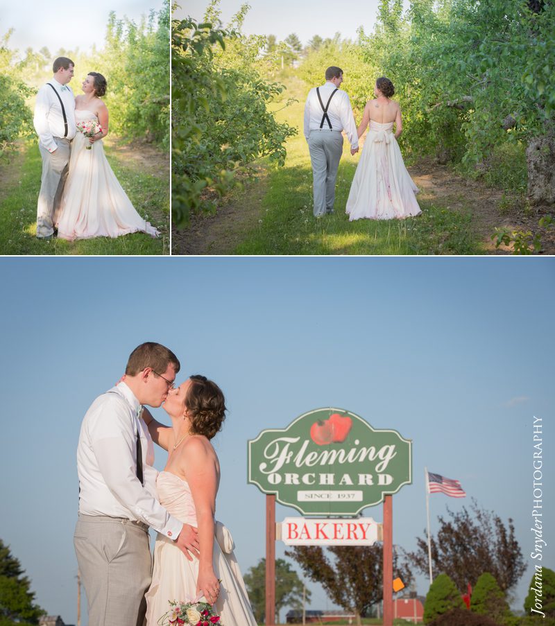 A couple kissing in front of the fleming bakery sign.