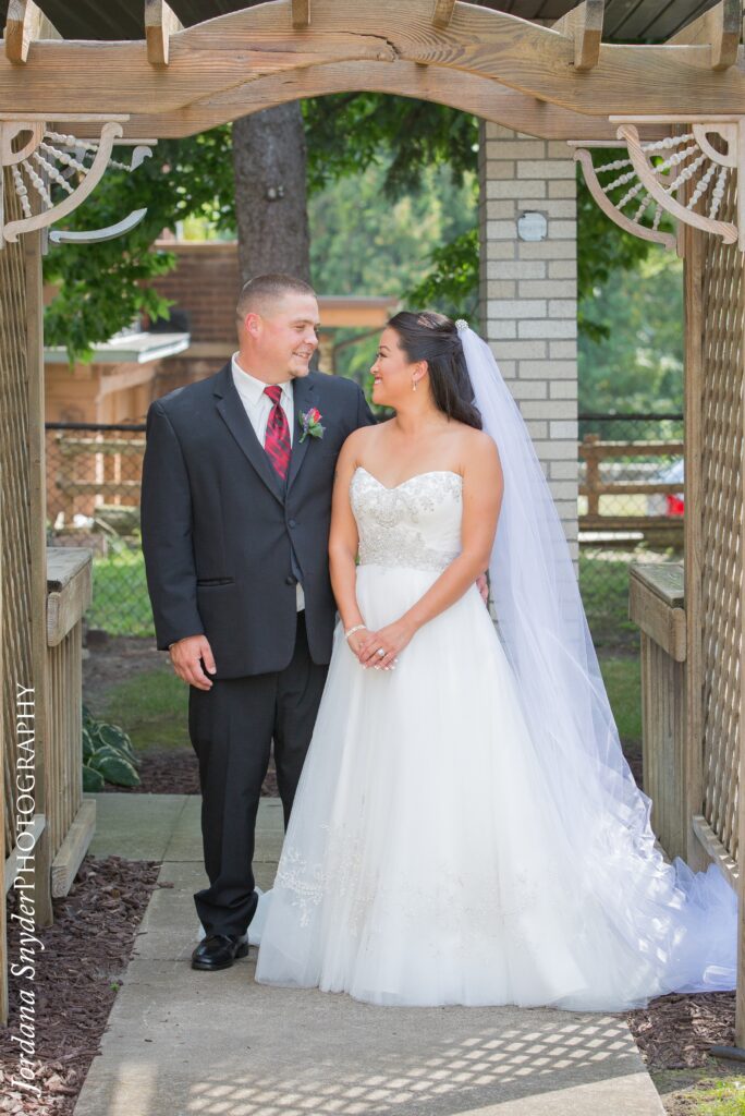 A man in a suit holding something in his hands.