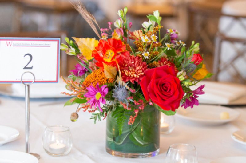 A vase of flowers on top of a table.