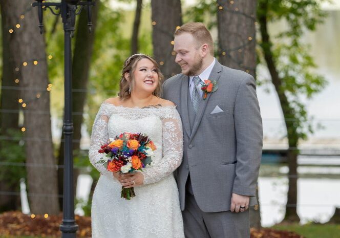 A man and woman standing next to each other.