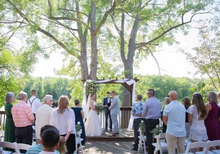 A couple getting married under the trees